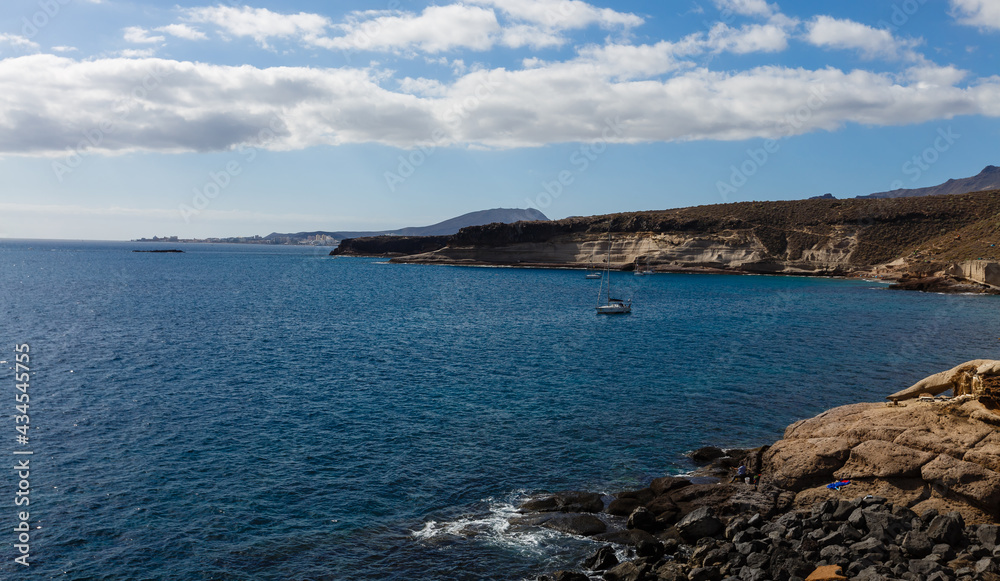 Calm ocean in the morning. ocean shore with stones Calm ocean in the morning. ocean shore with stones