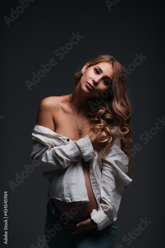 Young beautiful pregnant woman white shirt