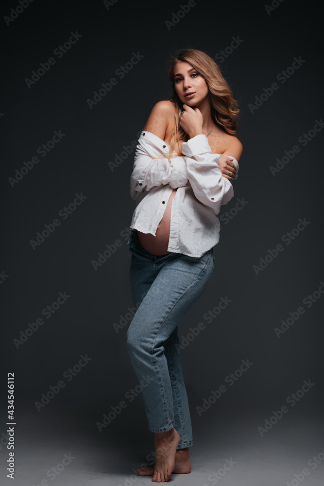 Young beautiful pregnant woman white shirt Young beautiful pregnant woman white shirt