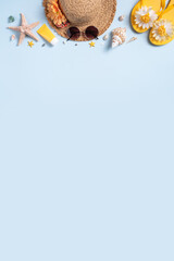 Summer beach background design concept with shells, hat, slipper on blue background.
