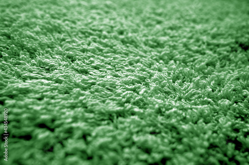 Bath towel texture with blur effect in green color.