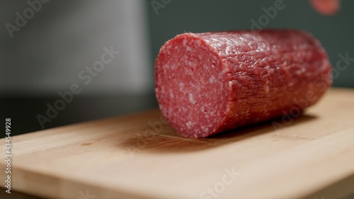 фотографія Salami Sausage On Wooden Board