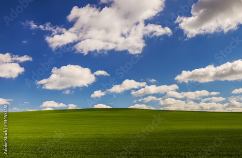Hilly landscape with cloudy sky windows XP like background