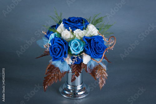 Flower arrangement against a grey backdrop photo