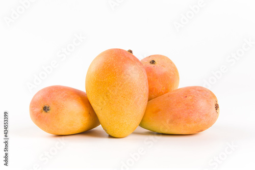 Ripe fresh mango fruit isolated on white background