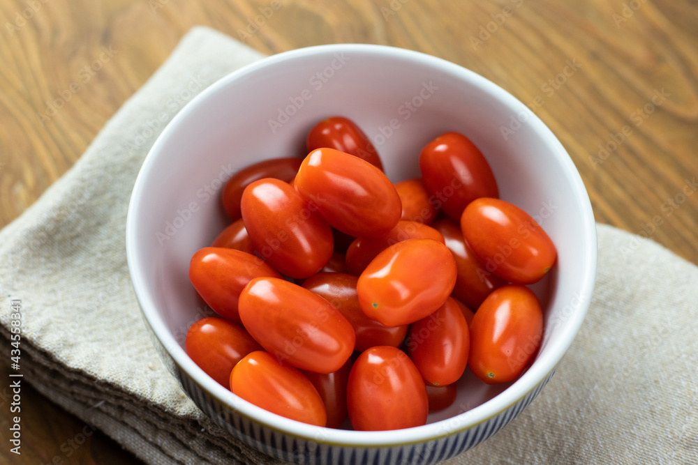 Cherry tomatoes in a white bowl ready to eat. Cherry tomatoes in a white bowl ready to eat.