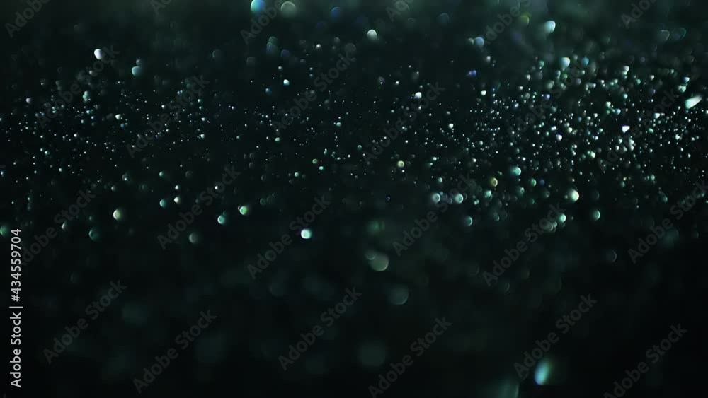 Cinematic background with green particles, Abstract motion of particles