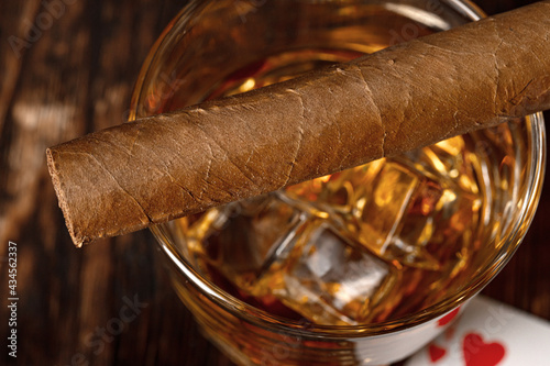 Playing poker with whiskey and cigars on table © fotofabrika