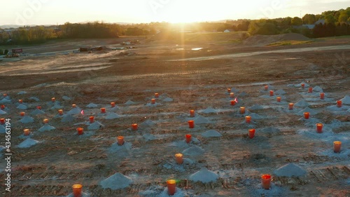 Excavation site is prepared to blast and drill rock. Dynamite used to break large granite shelf. Geology, ground and earth study. photo