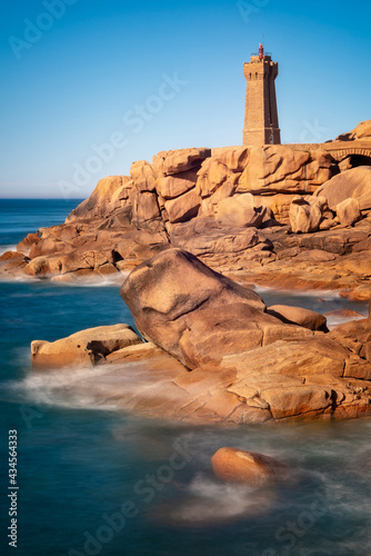 Lighthouse of Ploumanach at the golden hour in Perros-Guirec, Côtes d'Armor, Brittany, France © Delphotostock