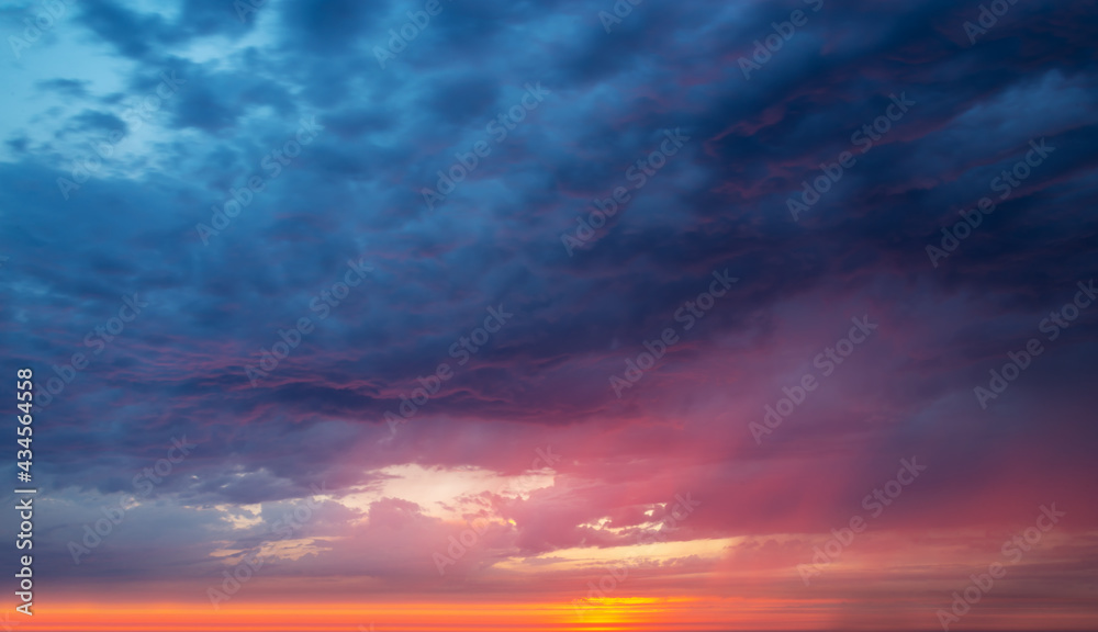 Colorful dramatic sky with clouds at sunset, nature background