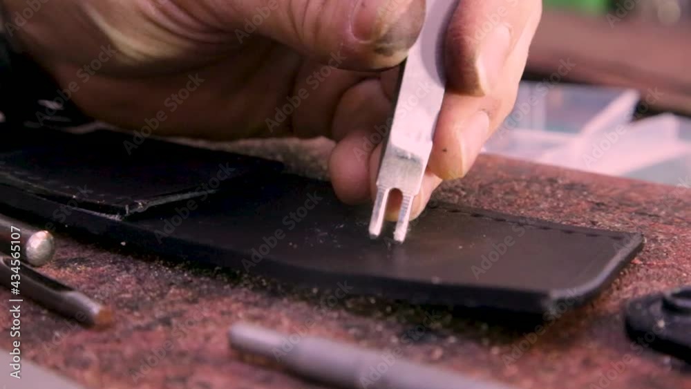 Drilling holes for further sewing of leather Drilling holes for further sewing of leather