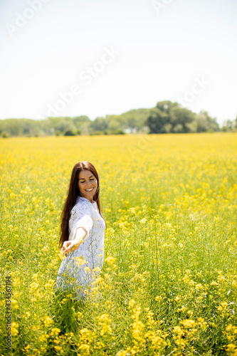Young woman in the rapeseed field © BGStock72