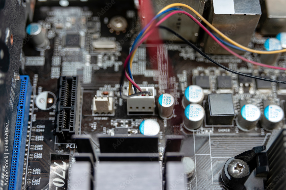Connected wires to the motherboard under the computer case. Connected wires to the motherboard under the computer case.