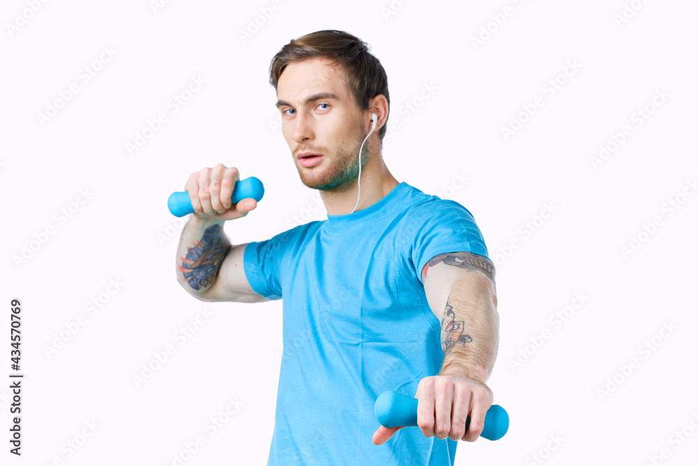 man with dumbbells in hands workout exercise fitness blue background man with dumbbells in hands workout exercise fitness blue background
