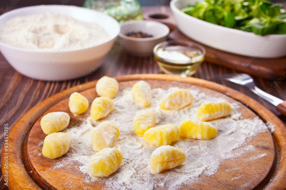Homemade Gnocchi potato pasta on floured board Homemade Gnocchi potato pasta on floured board