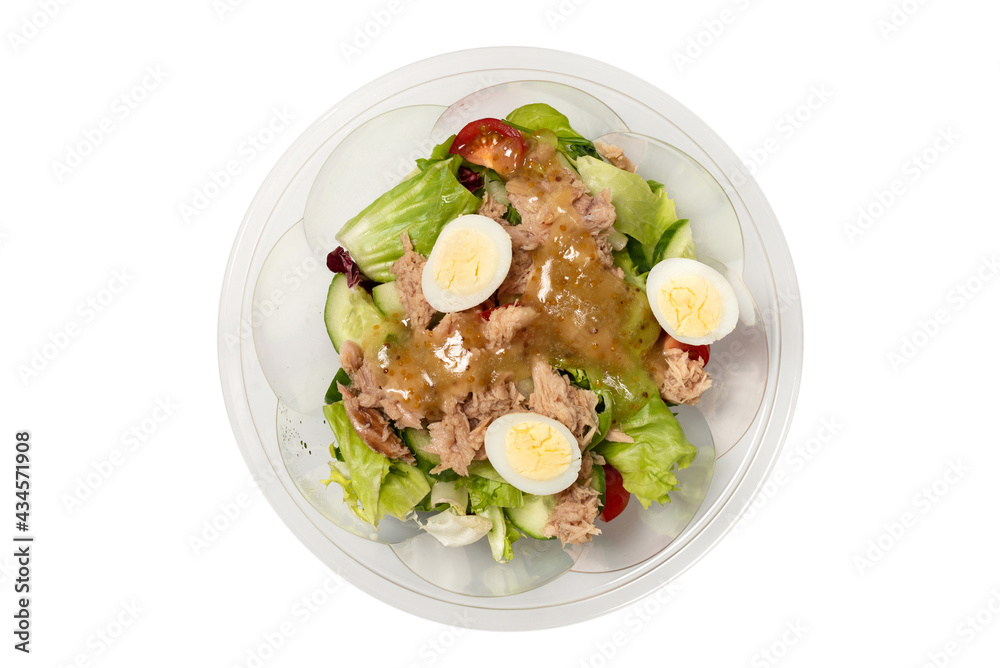 Fresh tuna salad with lettuce, cucombers, cherries and eggs in plastic container.