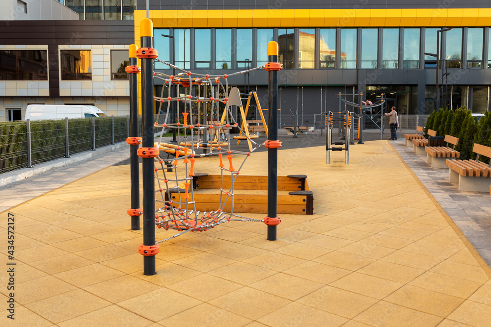 Modern children's playground near in a modern urban residential area. Without children.