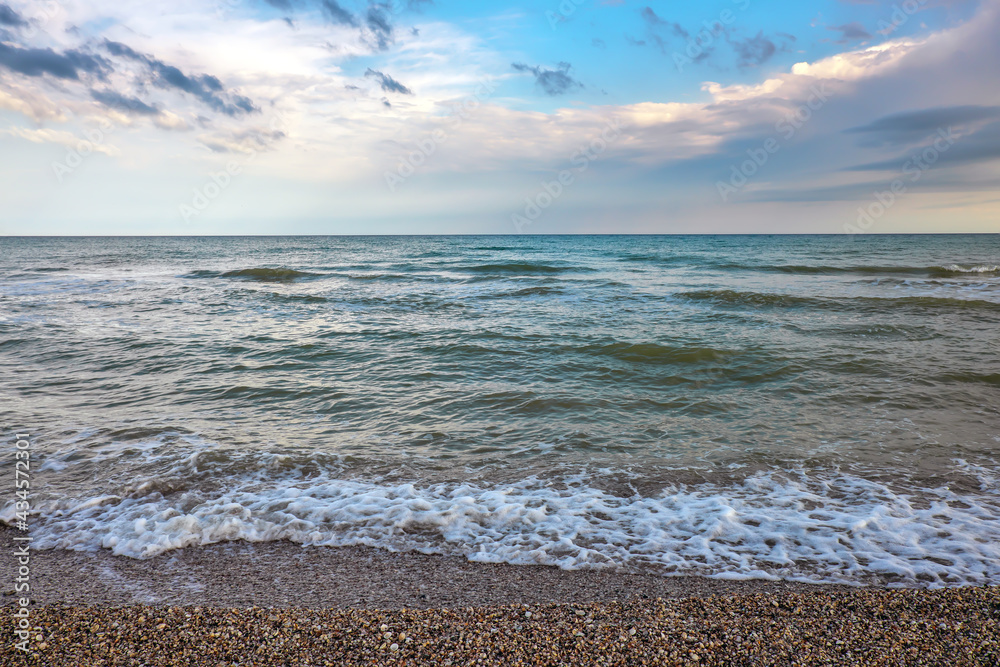 Summer landscape with sea, waves, cloudy clouds. Summer landscape with sea, waves, cloudy clouds.