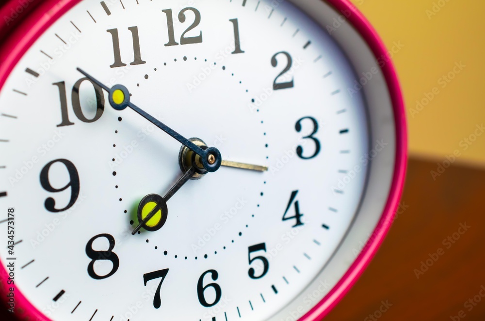 Mechanical hand clock white dial. Spring alarm clock. Mechanical hand clock white dial. Spring alarm clock.