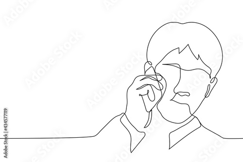 man speaks on the phone - one line drawing vector. one line portrait of a man with a telephone at his ear. telephone conversation, the guy listens to the interlocutor