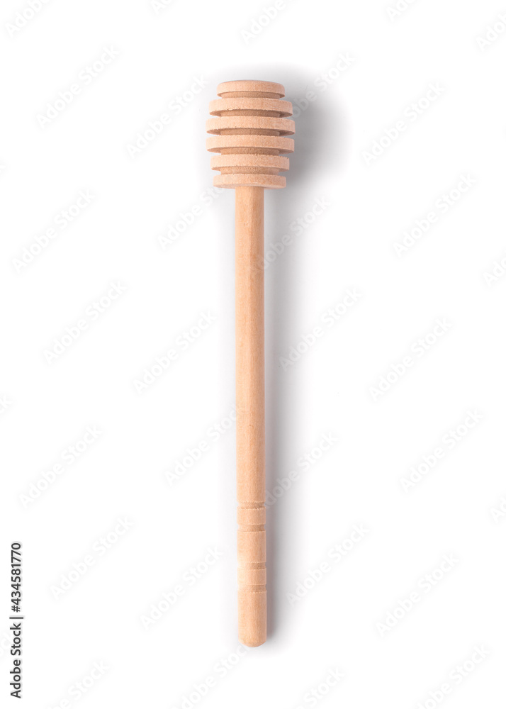 Close-up of honey dipper on white background