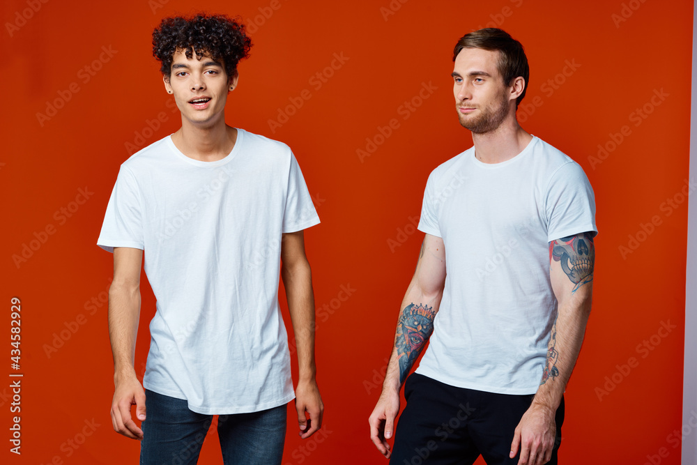 Two cheerful friends are gesturing with their hands emotions fun studio Two cheerful friends are gesturing with their hands emotions fun studio