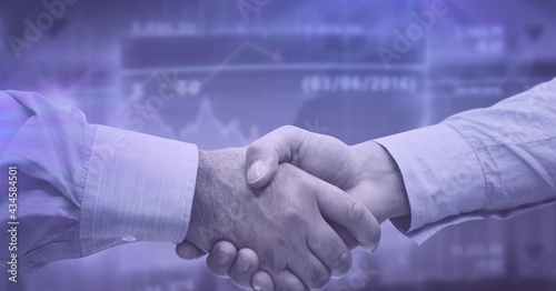 Composition of businessmen shaking hands over financial data on purple background