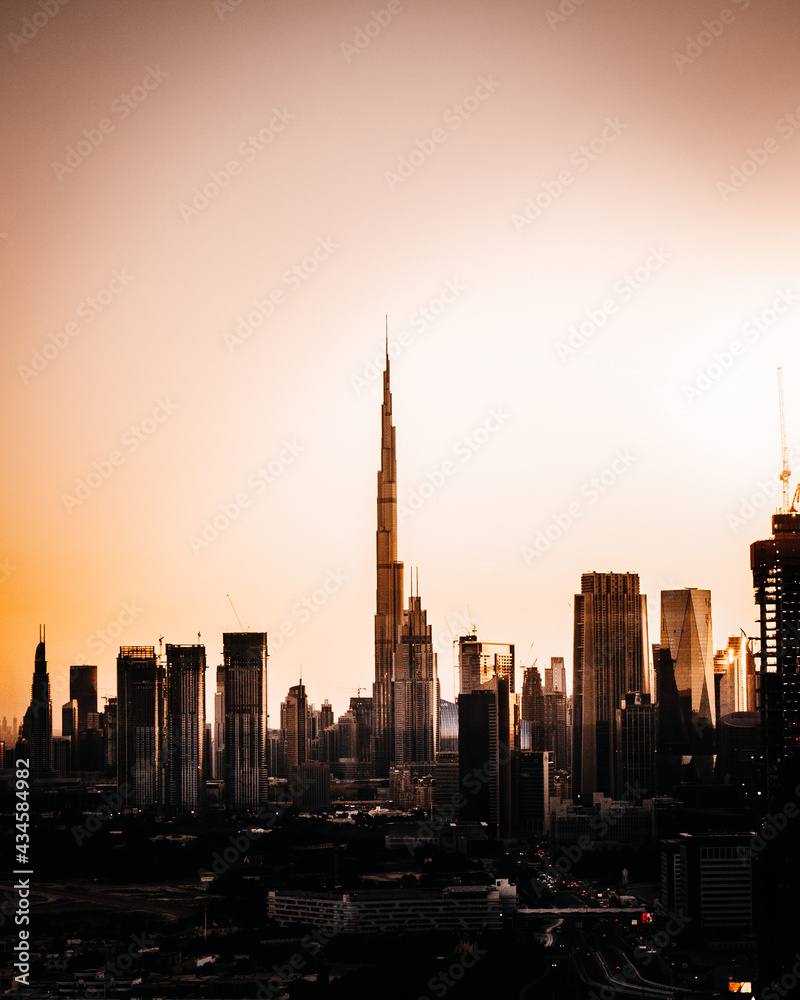 City centre of dubai during a dramatic sunset. Contrasty orange look. 