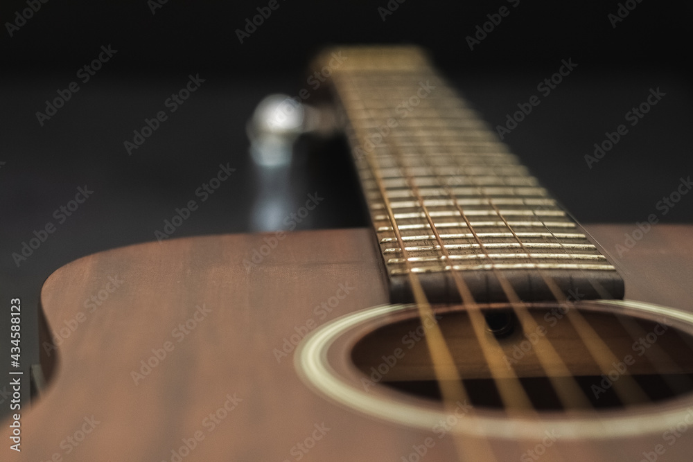 Fototapeta premium Solid mahogany acoustic folk guitar dreadnought