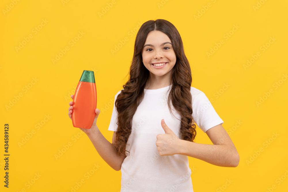 child with hair conditioner. daily habits and personal care. beauty bodycare. skin lotion for body child with hair conditioner. daily habits and personal care. beauty bodycare. skin lotion for body