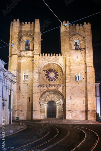Lisbon Cathedral illuminated at night in the Alfama district, Portugal