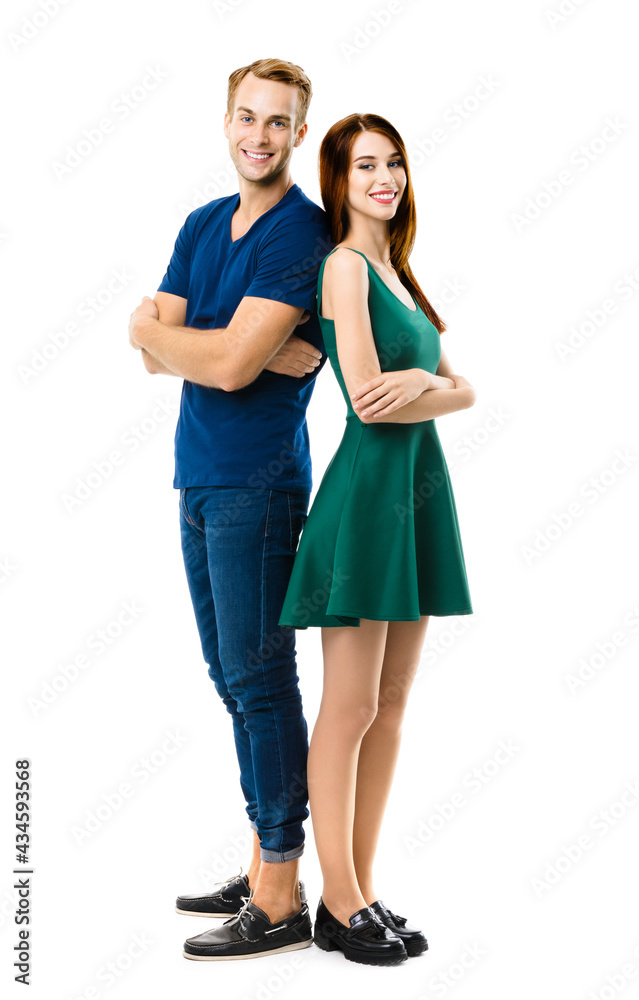 Smiling attractive couple. Full body length portrait of standing back to back models at happy in love studio concept, isolated over white background. Man and woman posing together. Smiling attractive couple. Full body length portrait of standing back to back models at happy in love studio concept, isolated over white background. Man and woman posing together.