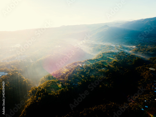 Aerial drone view of the foggy misty morning in Bali, Indonesia photo