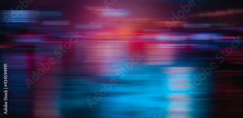 Blurred car light reflexion on road wet in the night city. speed light automobile