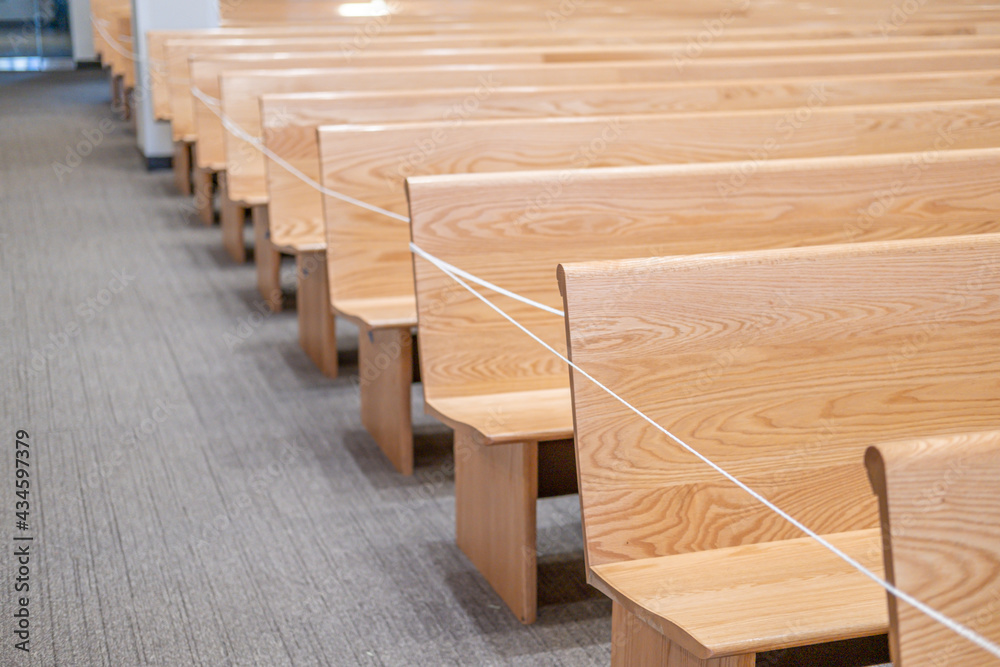 Church pews in Church roped of for covid 19 restrictions