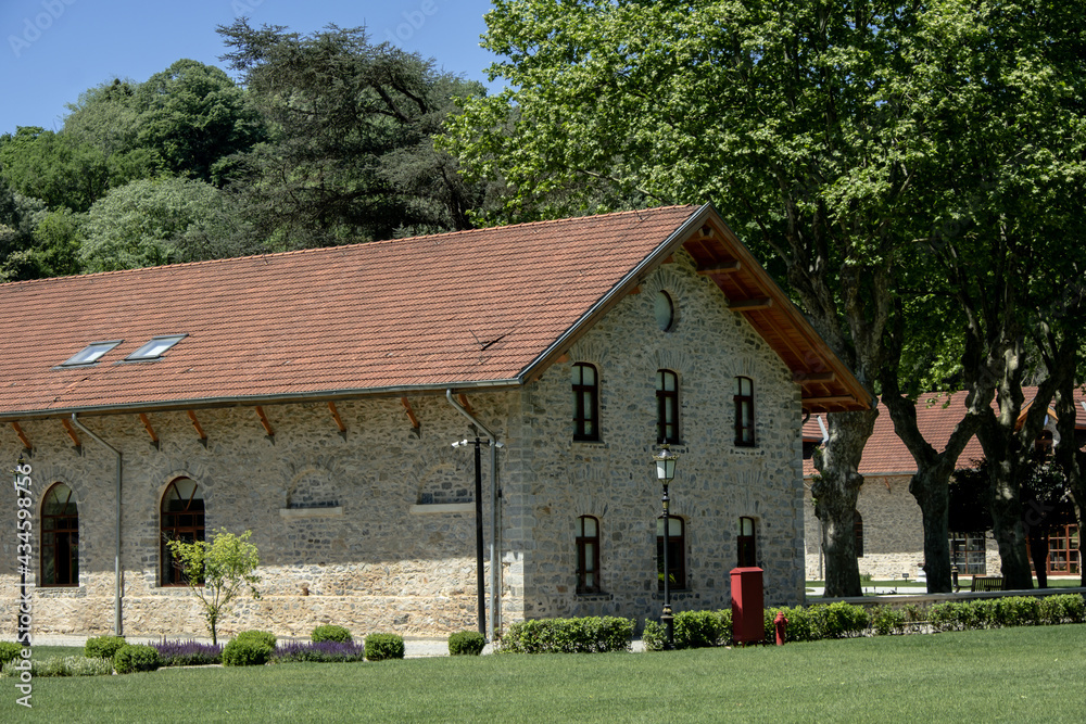 Obraz premium Beykoz, Istanbul, Turkey - May 2021: Beykoz Glass Museum. Historical museum building. Istanbul's historical buildings and museums. Stone museum building and garden. Centuries-old trees.
