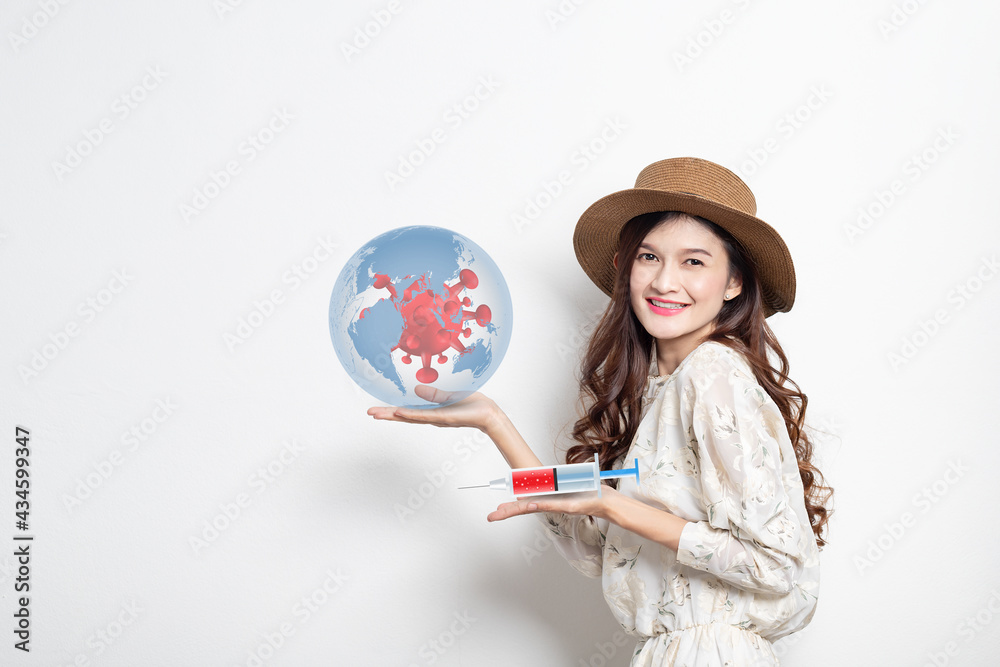 Fototapeta premium Young asian woman smiling holding a syringe with liquid vaccines, Concept fight against virus covid-19 corona virus, Conceptdiseases,medical care,science.