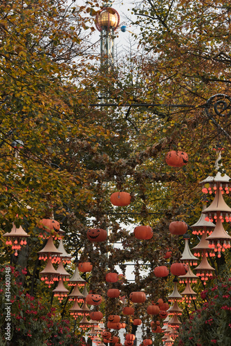 Halloween decoration at Tivoli in Copenhagen, Denmark. . High quality photo Halloween decoration theme in an outdoor public garden, scary pumpkins on the ground.