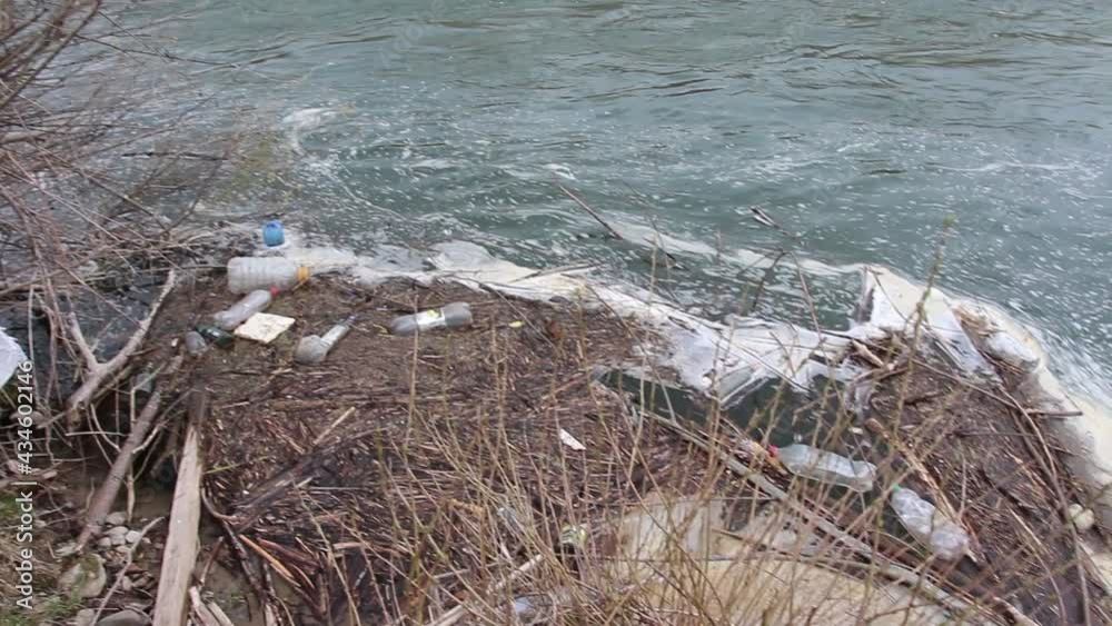 Contamination of the river. Chemical foam in the river. The river is polluted with chemical foam