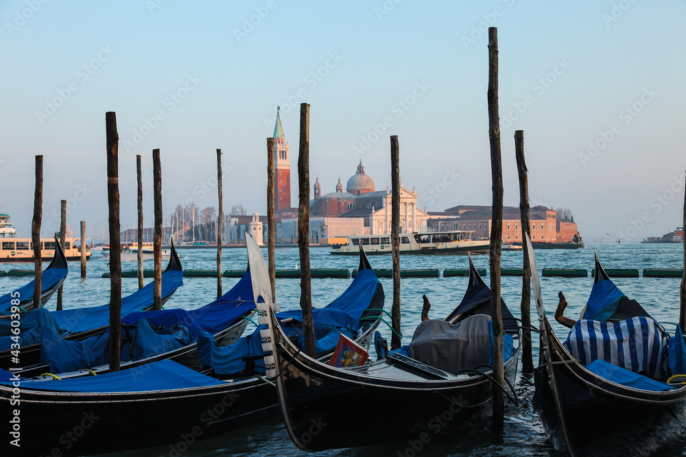 Gondolas in Venice at sunset.