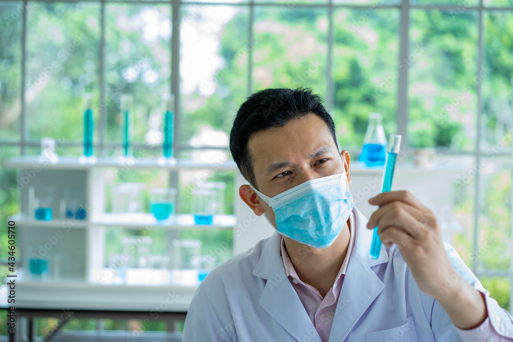 Asian medical  scientist working in clinical laboratory for virus vaccine 