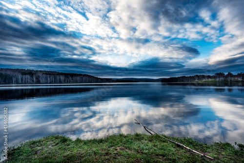 Blue Hour Sunrise over the lake with a beautiful reflections on the water. Serene lake in blue hour. Nature landscape