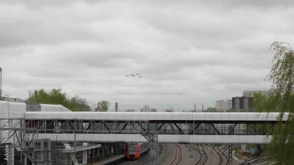 Military helicopters are flying in grey sky over big city. Pre war period Military helicopters are flying in grey sky over big city. Pre war period