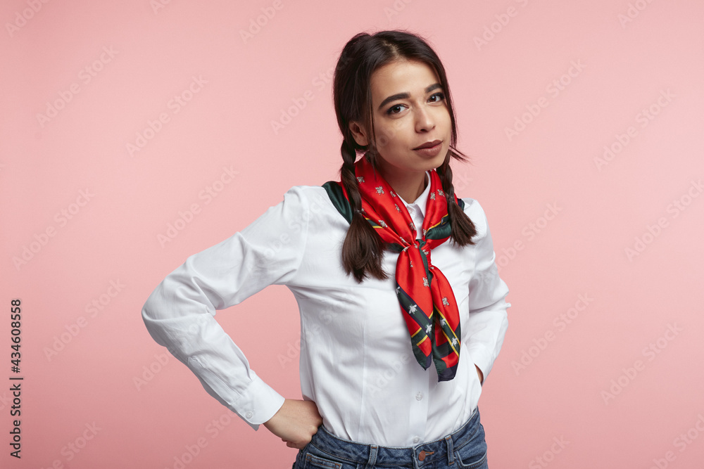 Young attractive girl wearing white shirt, isolated over pink background Young attractive girl wearing white shirt, isolated over pink background