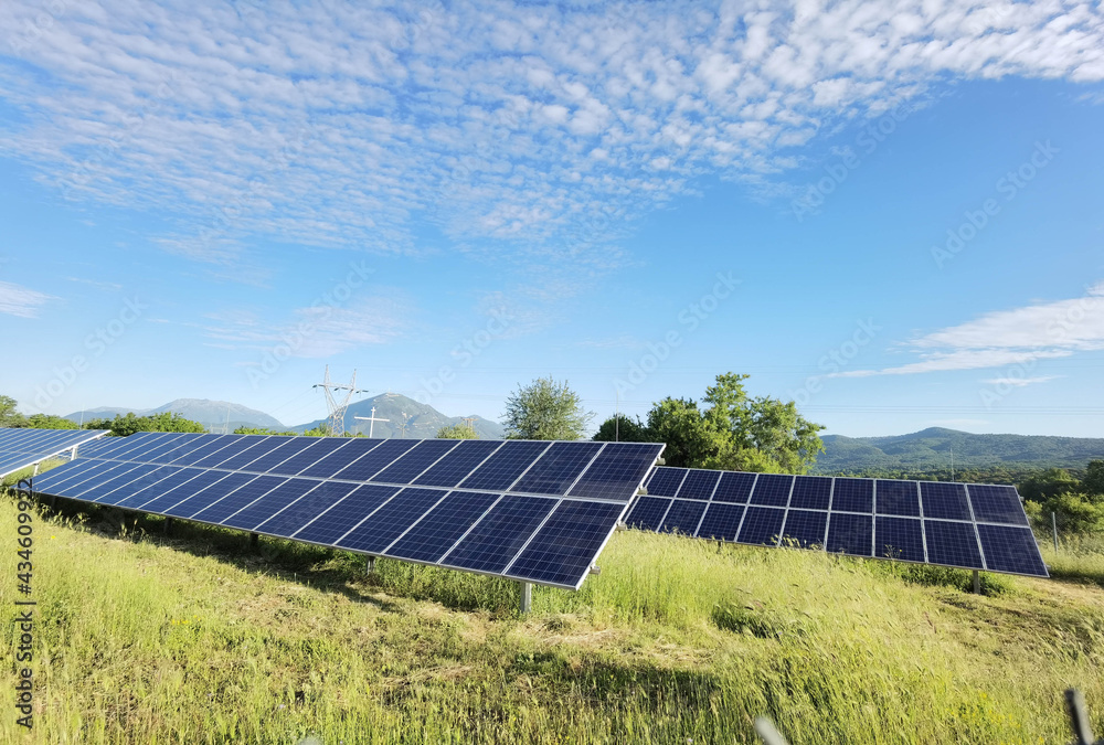 solar panels grass sky clouds electricity energy solar panels grass sky clouds electricity energy