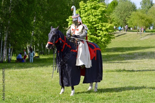 Knight in armor on a horse. Horse rider. Knight Templar. Knight Tournament. Belarus