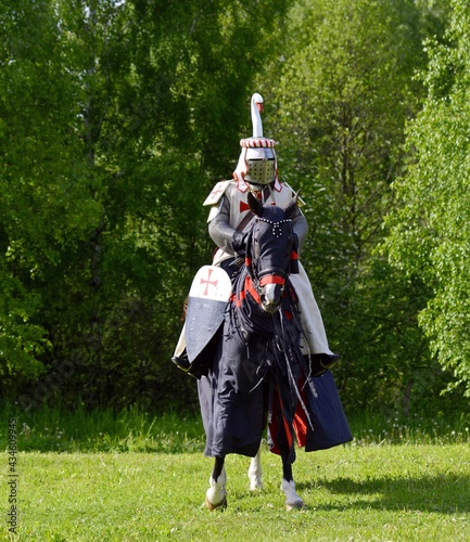 Knight in armor on a horse. Horse rider. Knight Templar. Knight Tournament. Belarus