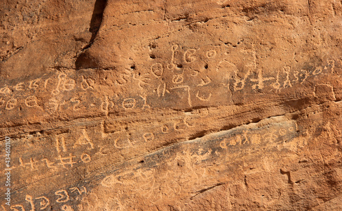 ancient nabataean inscription on the mountains in Wadi Rum, Jordan.