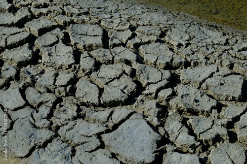 Some cracked earth in the salt marshes. Batz-sur-mer, France, the 8th may 2021.